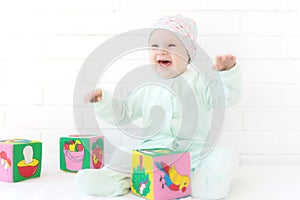 Baby playing with alphabet cube