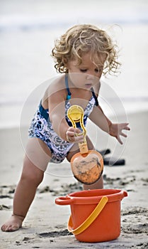 Baby playing at beach