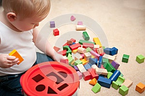 Baby playing with blocks and sorting shapes
