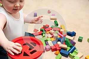 Baby playing with blocks and sorting shapes