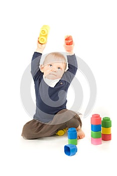 Baby playing with blocks on white background