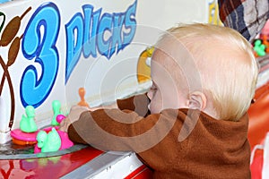 Baby Playing Carnival Duck Game