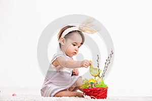 Baby playing with easter basket