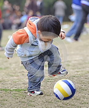 Baby playing football