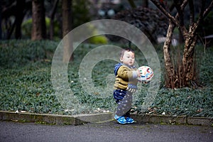 Baby playing with a Football