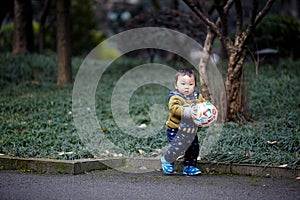 Baby playing with a Football
