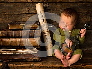 Baby playing guitar on wooden shelf