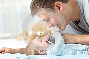 Baby playing with his father