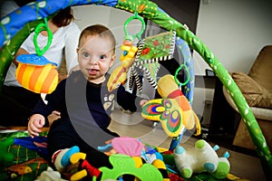 Baby playing indoor. Child, infant.