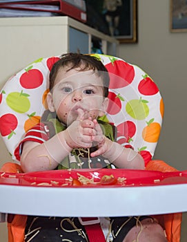 Baby playing with pasta