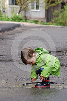 Baby playing in puddles photo