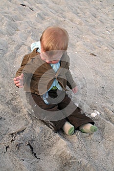 Baby playing in sand