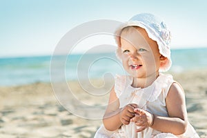 Baby playing at the sea