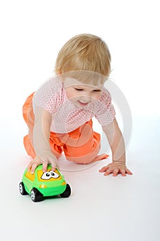 Baby playing with a toy car