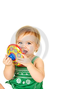 Baby playing with a toy top