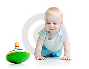 Baby playing with toy whirligig