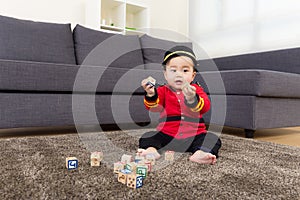 Baby playing with toys blcok