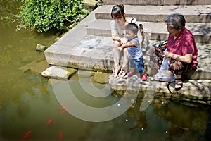 Baby playing at the waterside photo