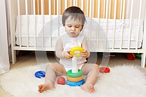 Baby plays nesting blocks