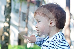 Baby pointing at the park