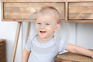 Baby Portrait. Adorable Smiling Toddler Boy Posing At Home, Looking At Camera