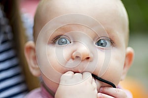 Baby portrait. Closeup face with bright blue eyes. Adorable baby