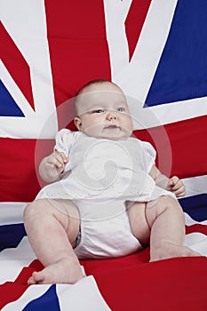 Baby propped up on a chair