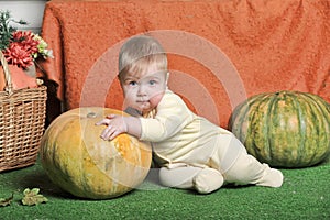 Baby with pumpkin