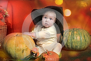 Baby with pumpkin