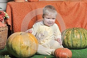 Baby with pumpkin