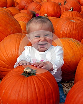 Baby in Pumpkin Patch