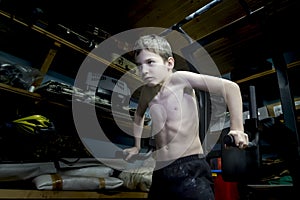 Baby push-UPS on bars in garage at home. Strength exercise. Active healthy lifestyle concept, weight training. Sport lifestyle