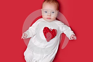 Baby on red background