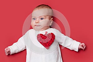 Baby on red background