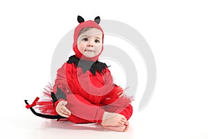 Baby with a red demon disguise photo