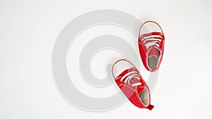 Baby red sneakers isolated on white background. baby shoes