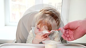 The baby refuses to eat childrens cottage cheese from a jar