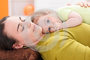 Baby resting on her mother chest