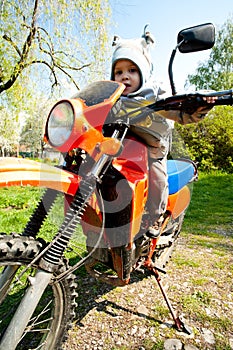 Baby riding motorcycle