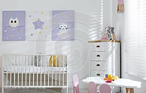 Baby room with cute posters and crib