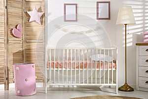 Baby room interior with comfortable crib