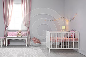 Baby room interior with comfortable crib