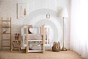 Baby room interior with toys and stylish furniture