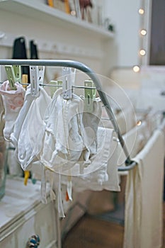 Baby& x27;s clothes, bodysuits and pants are dried after the laundry. Organization and cleaning in the children& x27;s