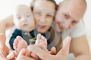 Baby's feet in parent's hands