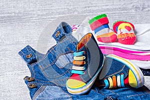 Baby shoes for babies and a set of clothes