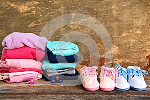 Baby shoes, clothing and pacifiers pink and blue