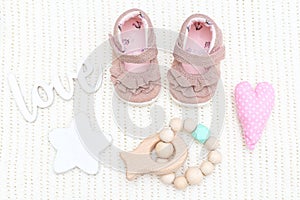 Baby shoes for girls and teether wooden