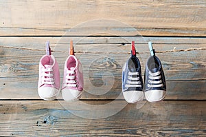 Baby shoes hanging on the clothesline.