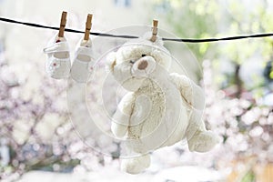 Baby shoes hanging on the clothesline